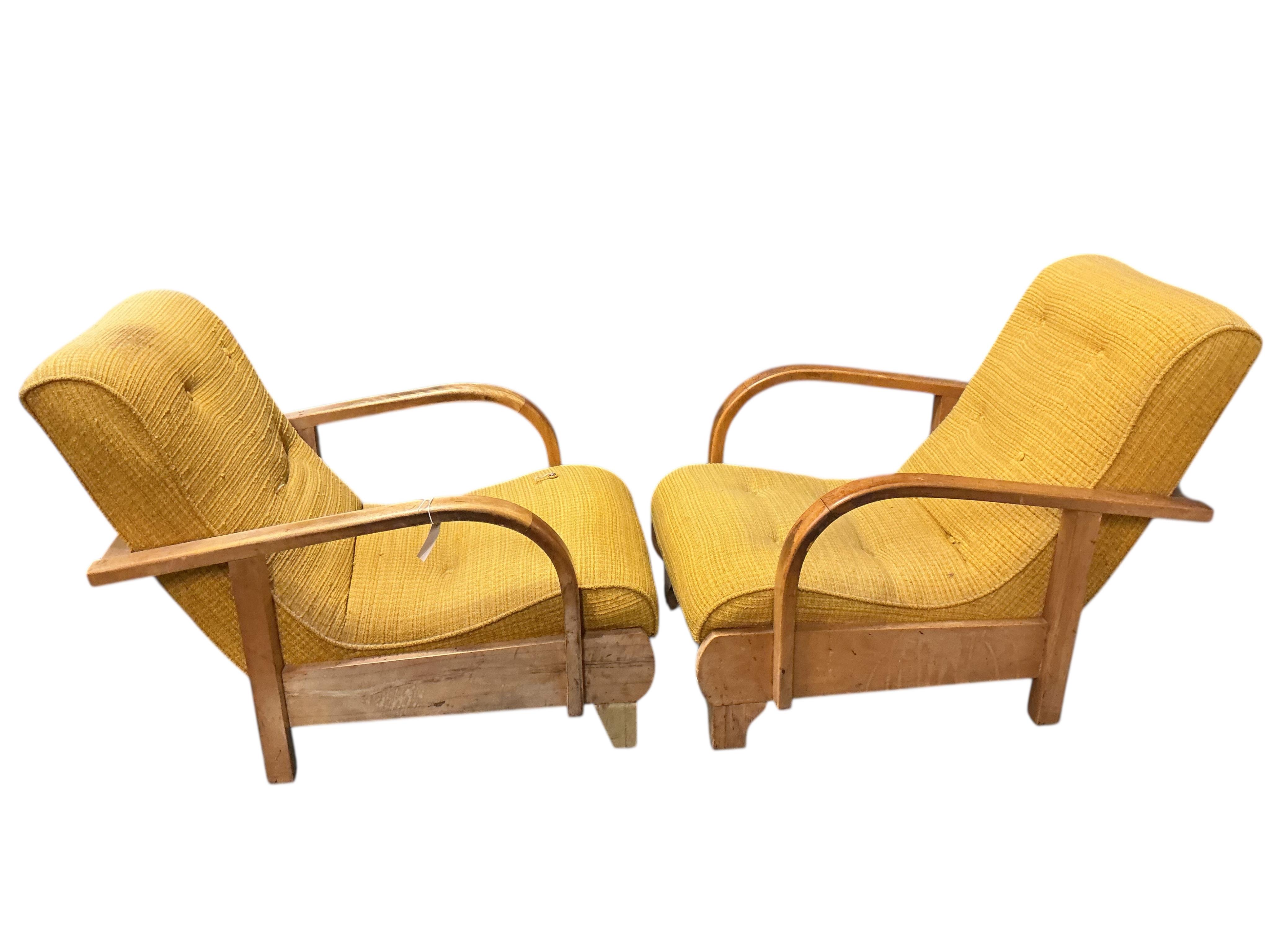 In the manner of Gerard Summers: A pair of mid century teak lounge chairs, width 57cm, depth 82cm, height 82cm